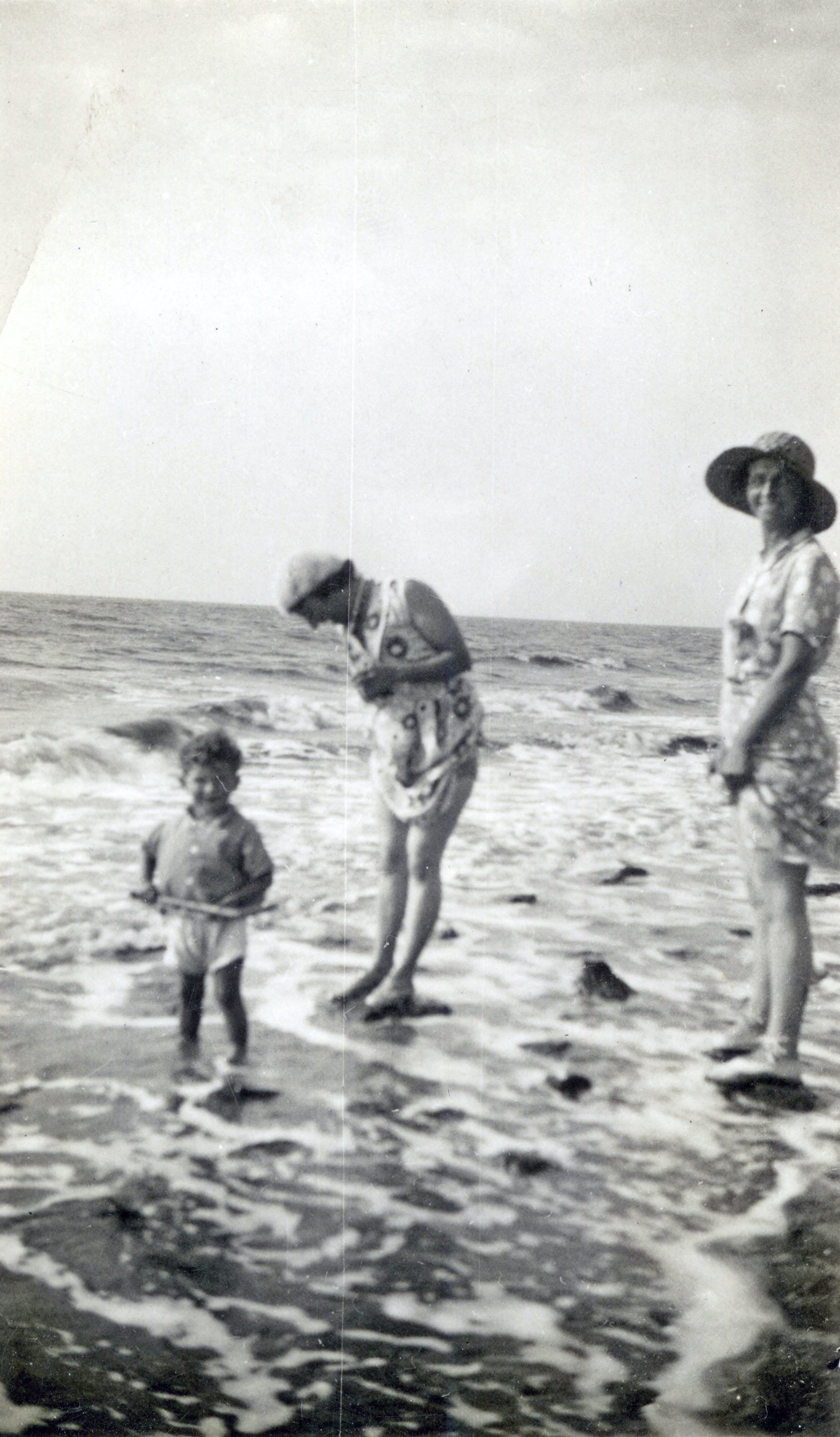 black and white photo of family at the beach