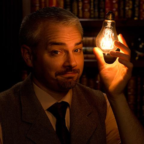 Peter Wood holding a lightbulb 